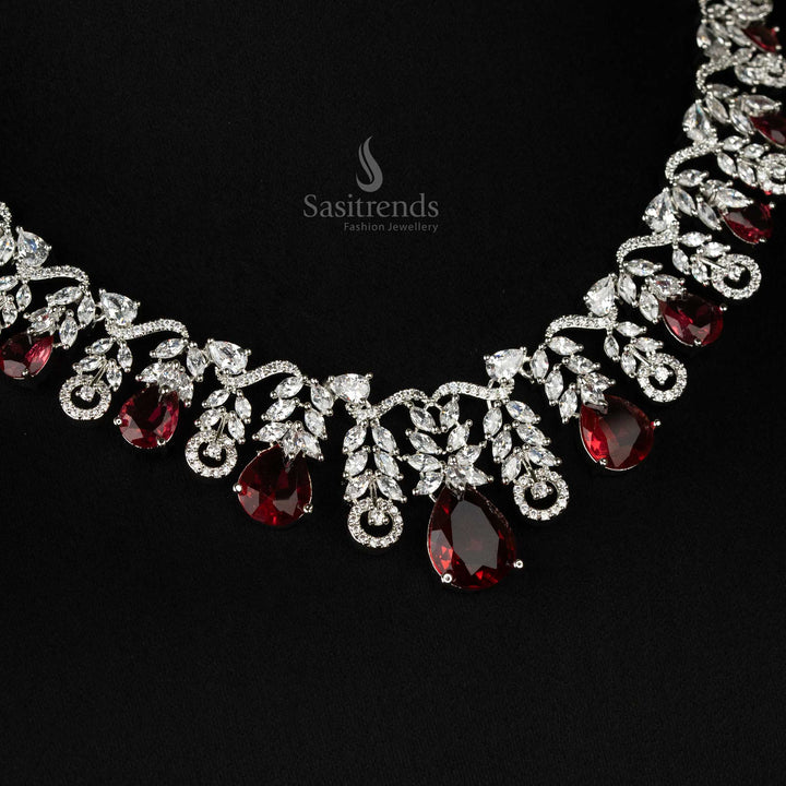 Glamorous red cascading leaf motif necklace set in rhodium silver plating, featuring teardrop American diamonds - Sasitrends