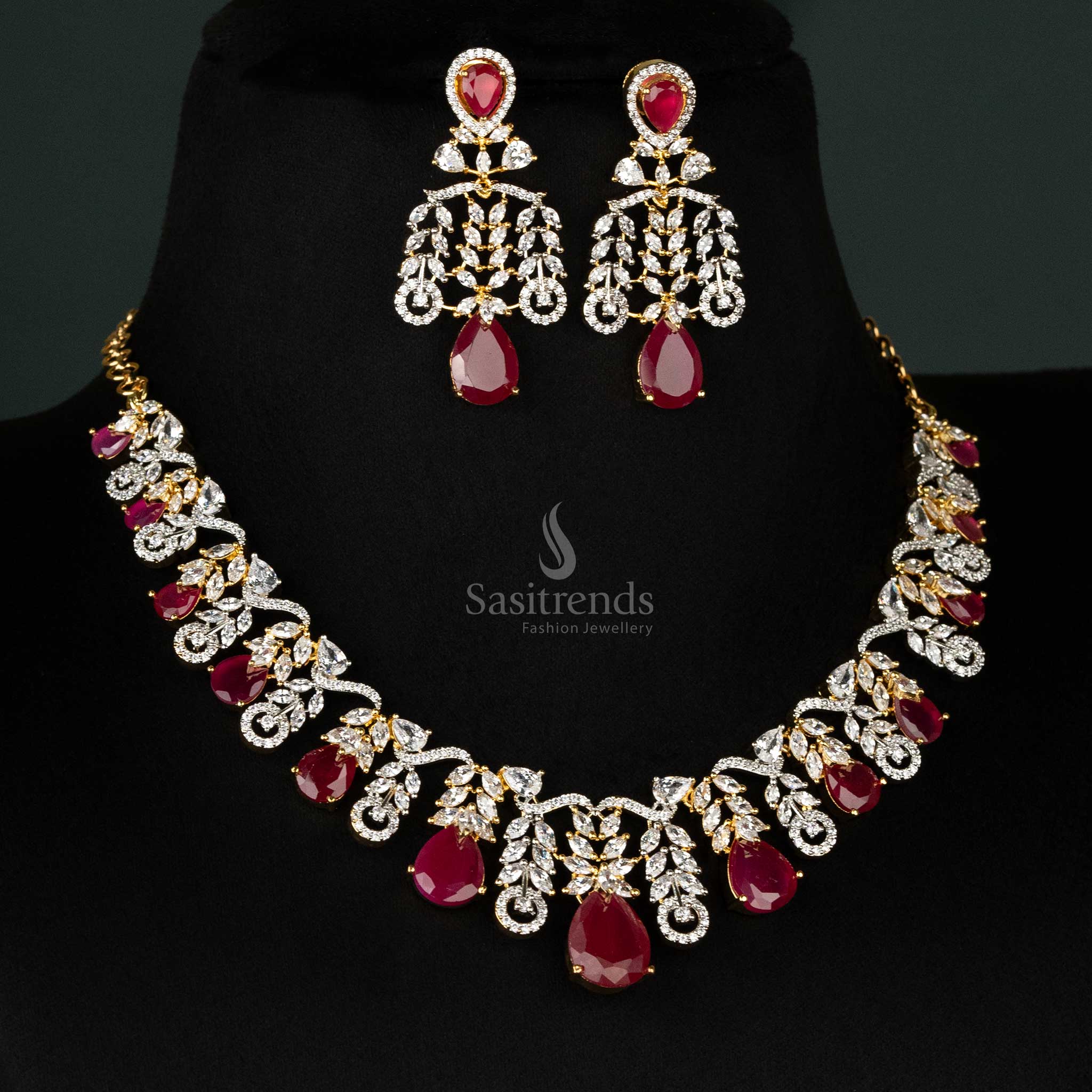 Stunning ruby necklace set in gold-plated finish, showcasing cascading leaf designs and teardrop American diamonds for elegant occasions - Sasitrends