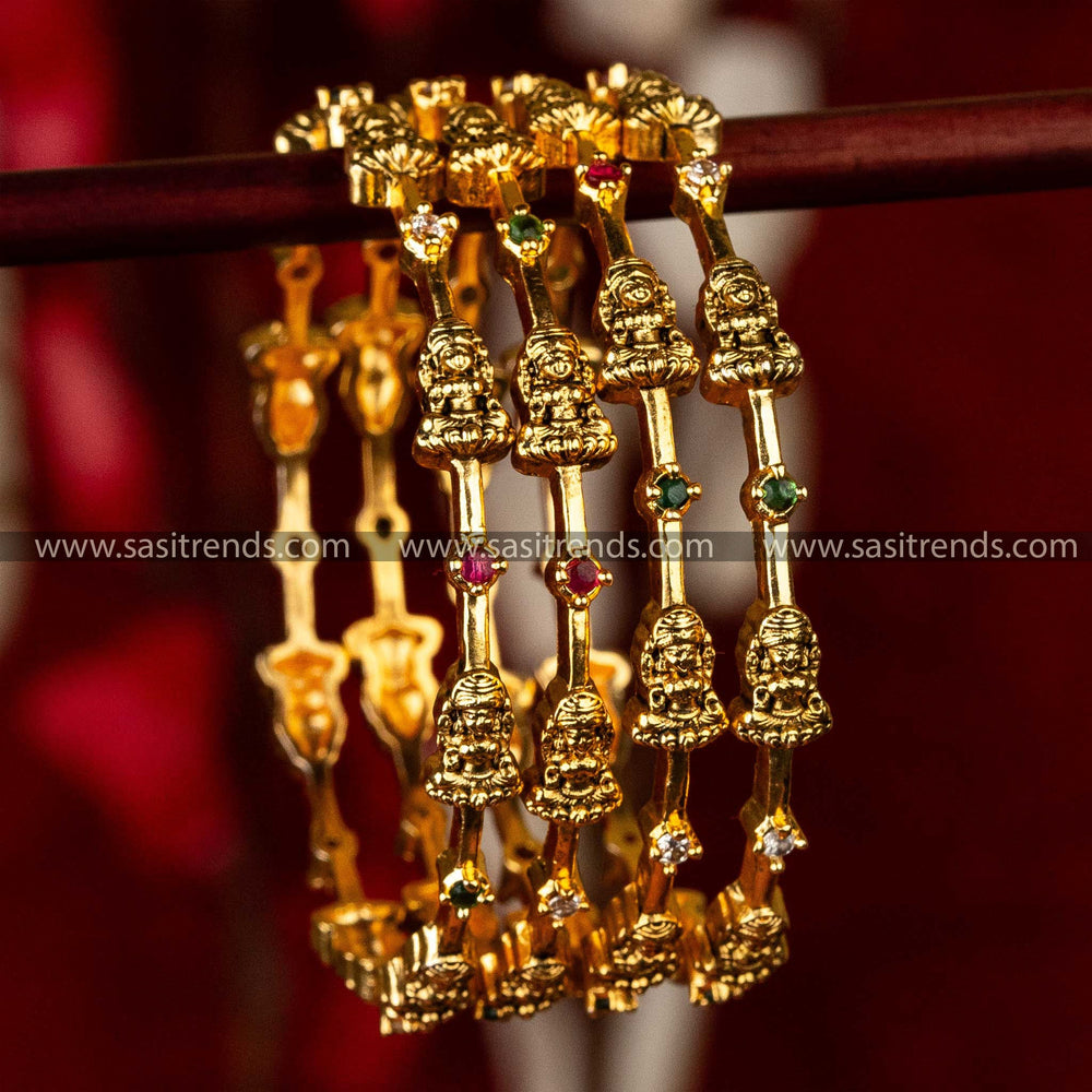 Temple Wear Matt Gold Plated Four Pieces Round Multi AD Stone Lakshmi Motif Bangles