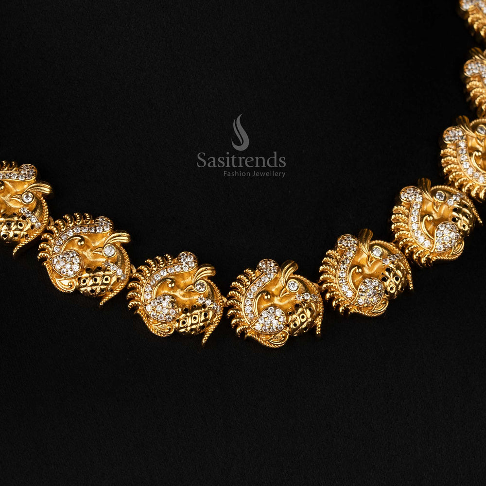 Elegant traditional temple jewellery set crafted in matte gold plating with intricate peacock designs and dazzling AD stones - Sasitrends