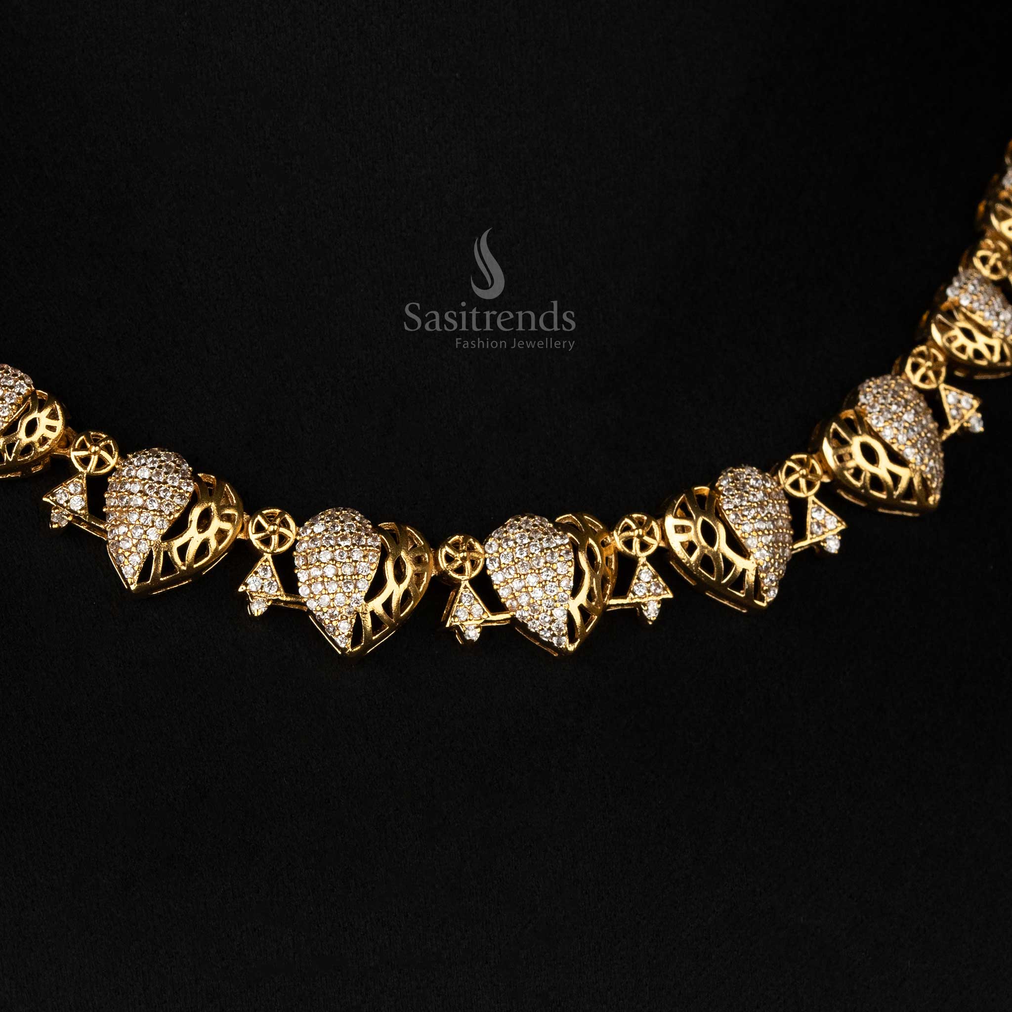 Elegant matte gold jewellery set with intricate heart patterns and AD embellishments - Sasitrends