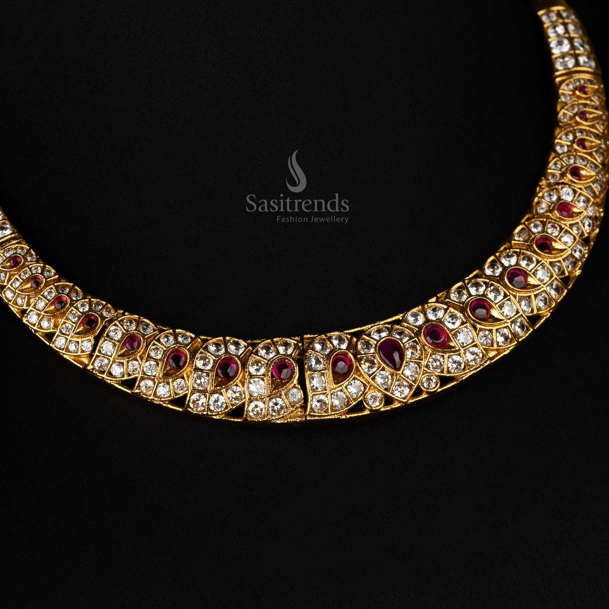 Ruby and AD-studded necklace set with matte gold finish and jhumkas - Sasitrends