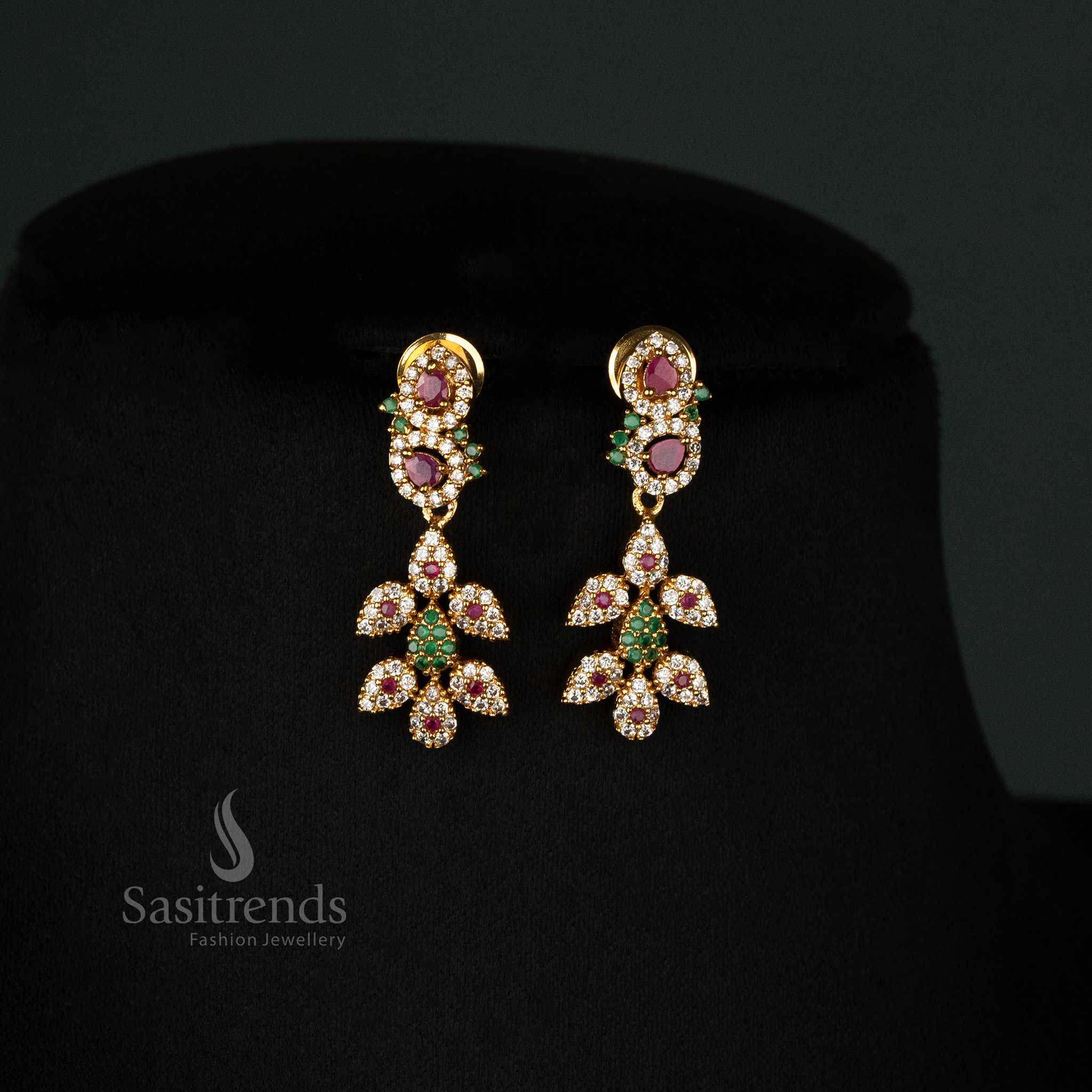 Traditional handcrafted temple jewellery set with multi-gemstone embellishments, matte gold plating, AD stones, and an elegant floral tilak design, paired with statement earrings - Sasitrends