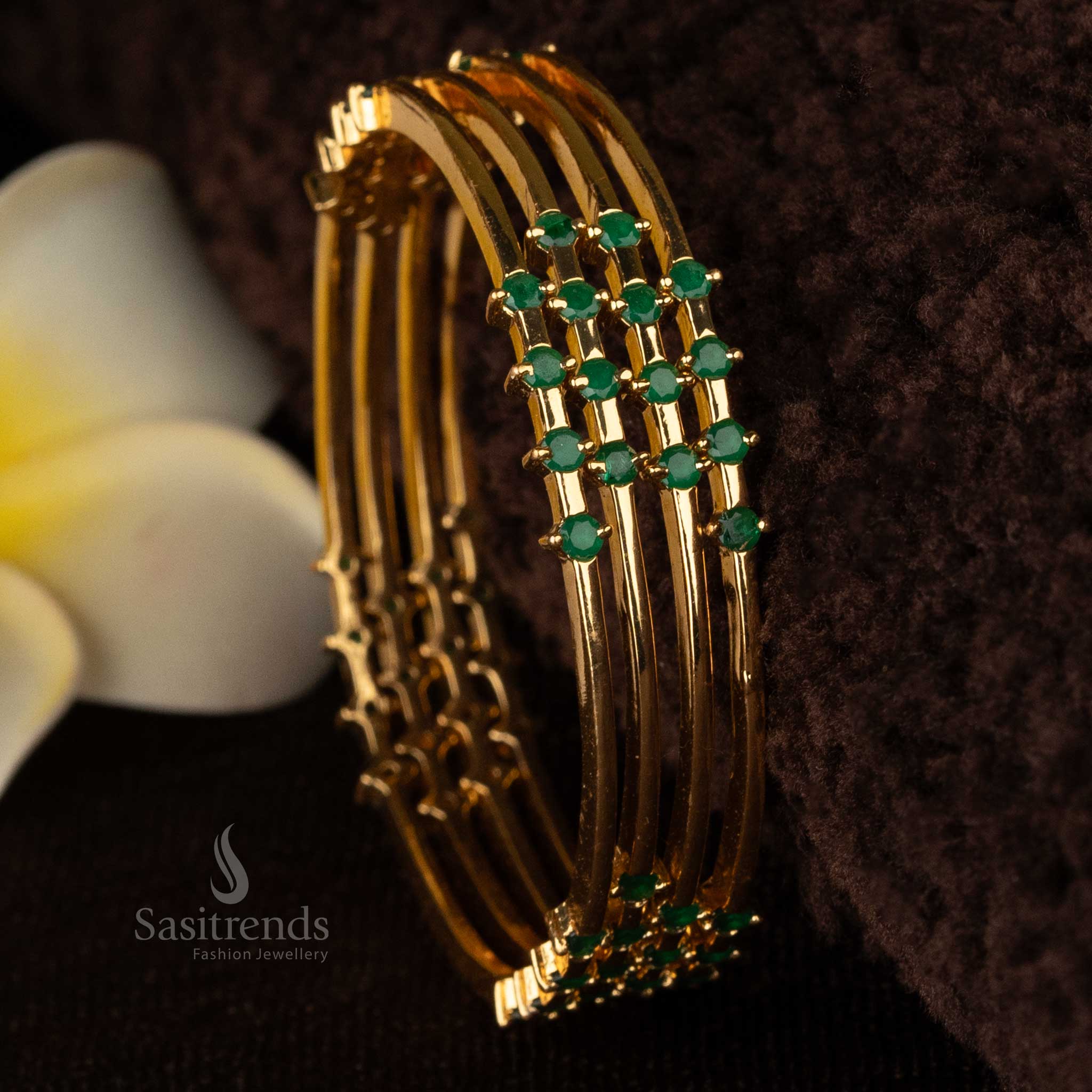 Stunning micro gold-plated bangles adorned with dazzling green stones, ideal for weddings and festive wear - Sasitrends