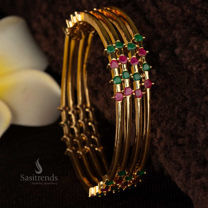 Luxurious gold-plated bangles featuring intricate craftsmanship and ruby green AD stones for a regal appearance - Sasitrends