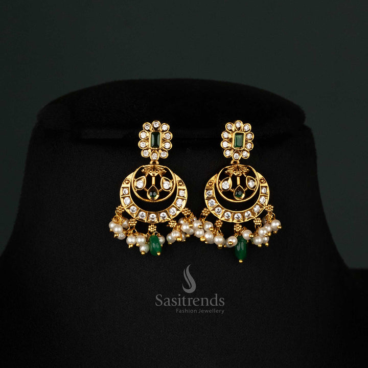 Elegant temple matte gold-plated  green American diamond stones, floral motifs, pearls, matching jhumkas - Sasitrends