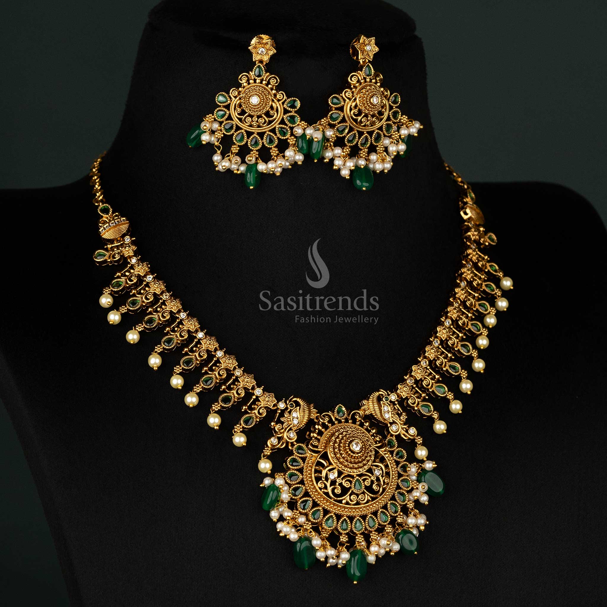 Elegant traditional jewellery set with green beads, matte gold finish, and intricate filigree details for a refined look - Sasitrends