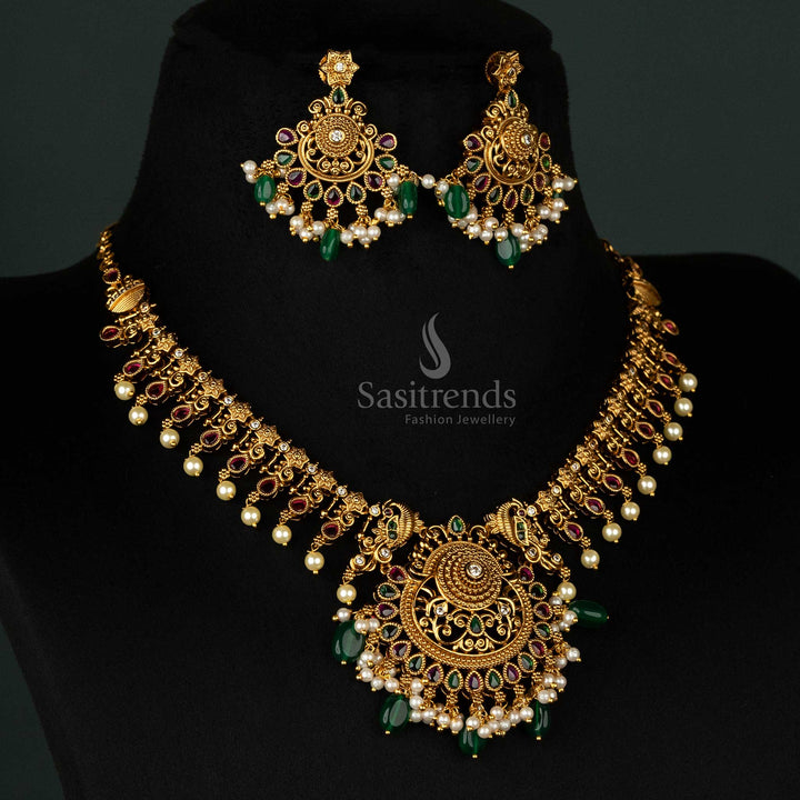 Classic matte gold jewellery set adorned with ruby and green beads, pearls, and exquisite filigree work for a regal touch - Sasitrends