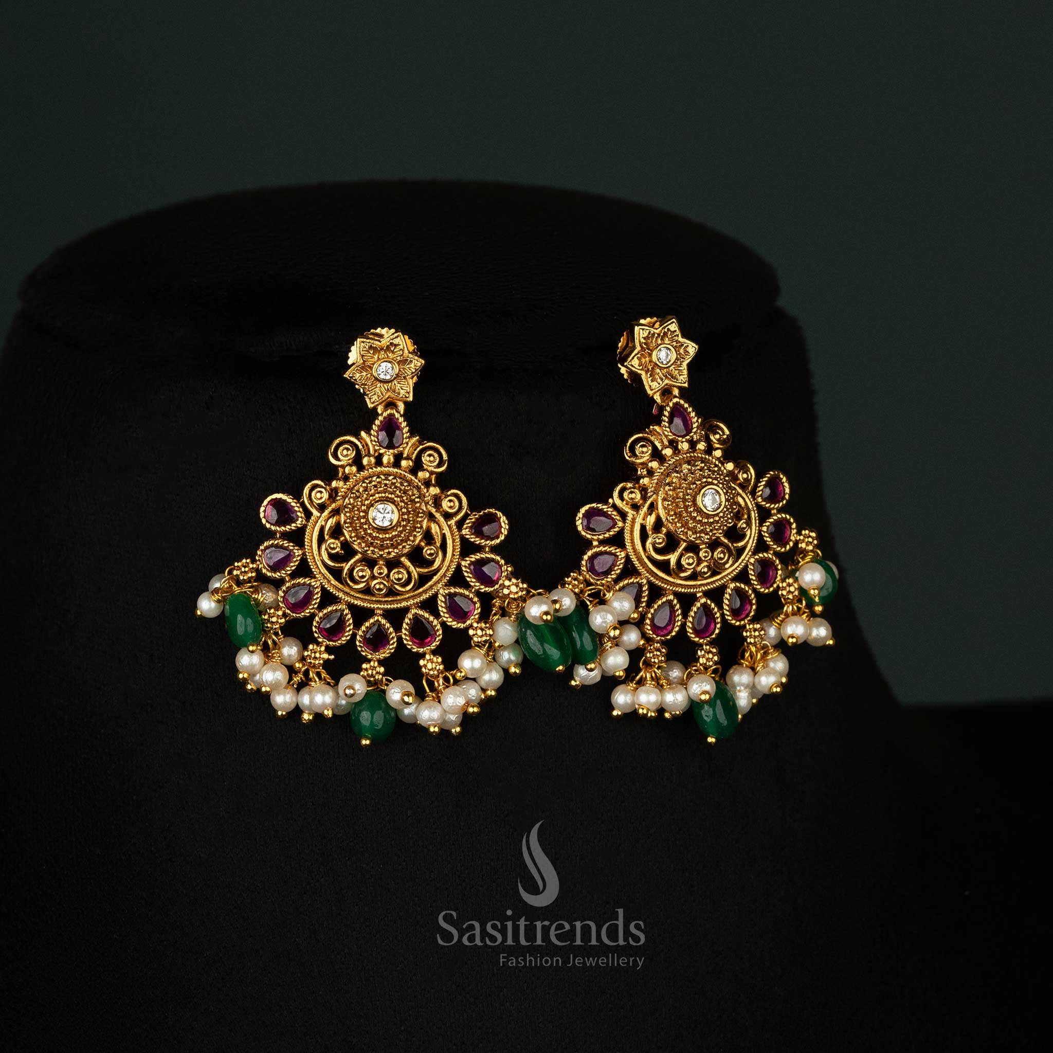 Beautiful ruby-studded matte gold-plated traditional jewellery with intricate filigree and pearl details for a festive touch - Sasitrends