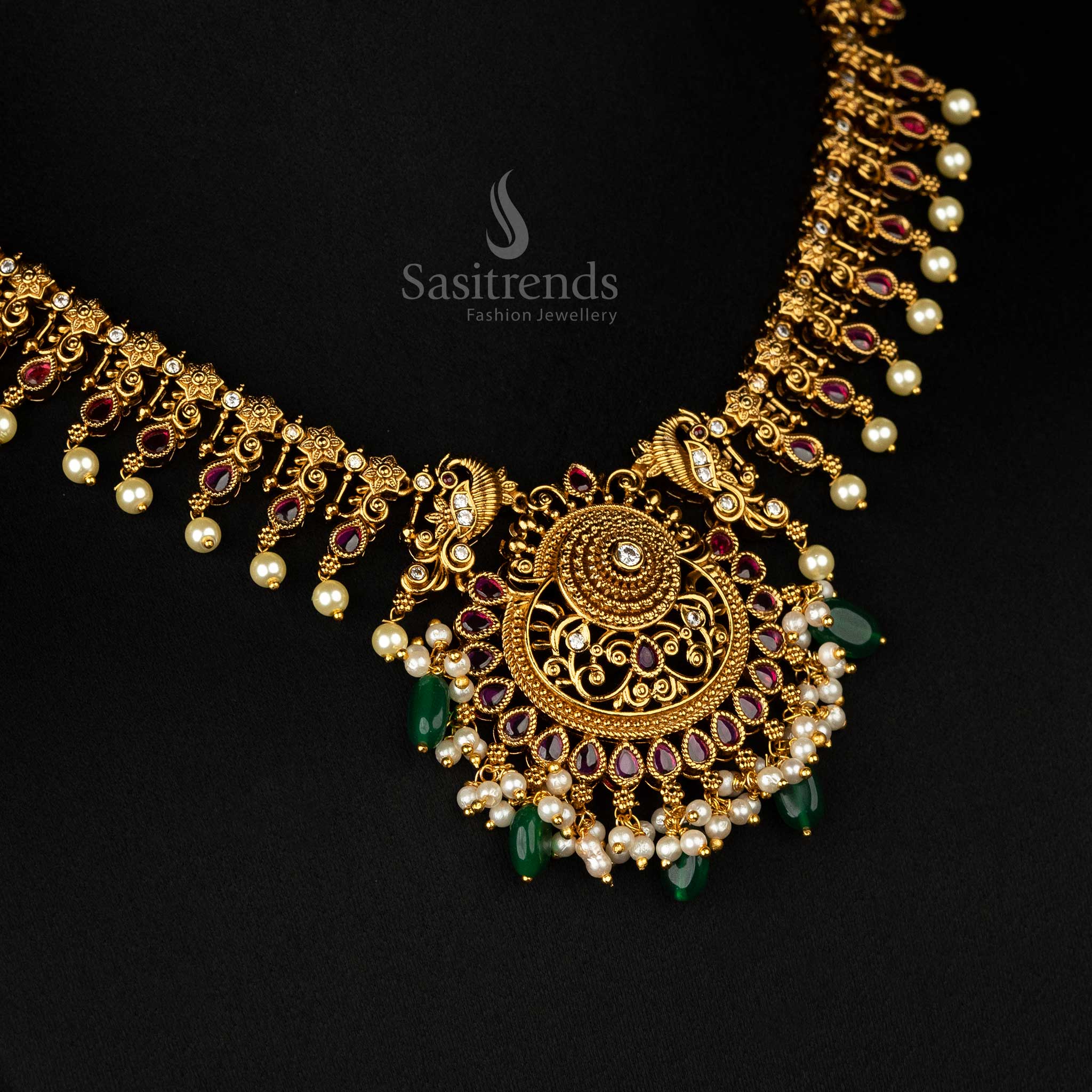 Elegant traditional jewellery set with ruby stones, matte gold finish, and intricate filigree details, perfect for weddings - Sasitrends