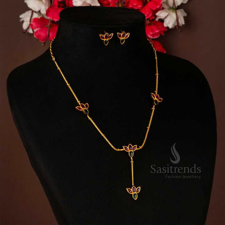 Traditional temple jewellery set in matte gold, boasting detailed lotus craftsmanship with exquisite ruby-emerald embellishments for a majestic touch - Sasitrends