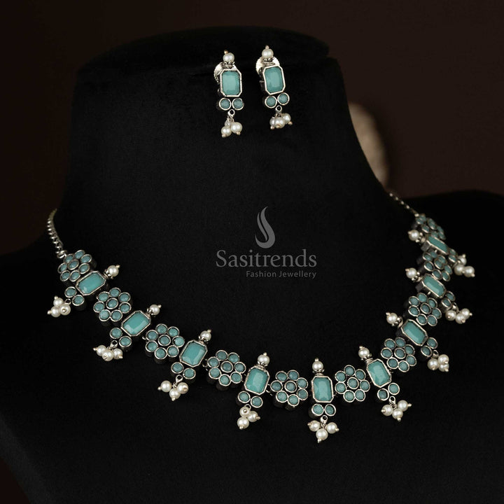 Charming oxidized floral necklace set with pearl drops in soft mint, adding a touch of elegance to any graceful outfit - Sasitrends