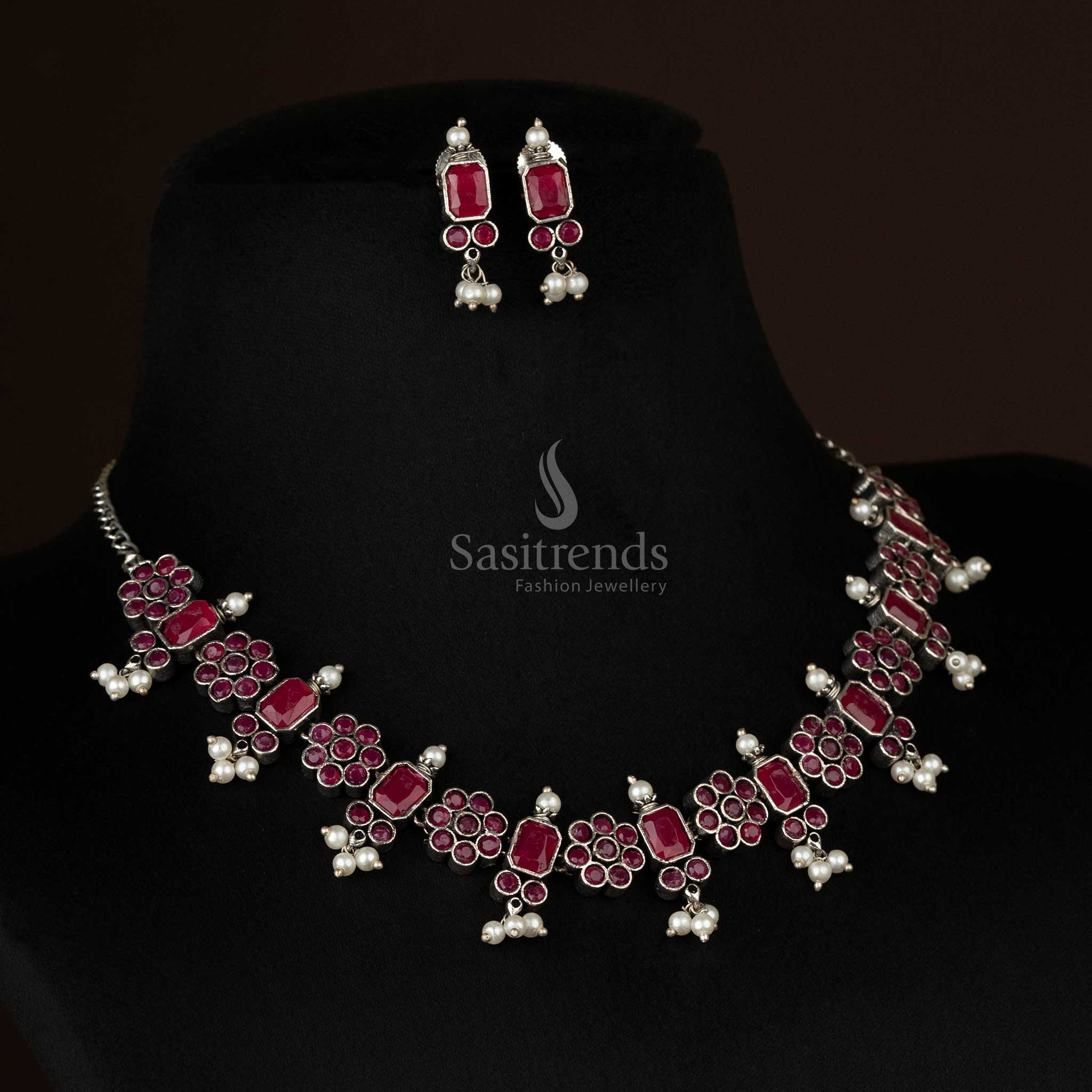 Elegant oxidized floral necklace set with pearl drops in vibrant ruby, featuring intricate floral patterns, perfect for traditional and festive occasions - Sasitrends