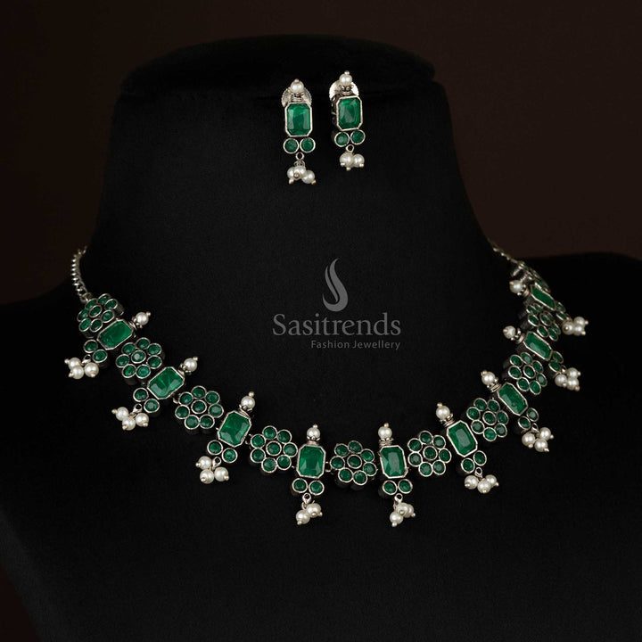 Radiant oxidized floral necklace set with pearl drops in emerald green, enhancing the elegance of ethnic and contemporary outfits - Sasitrends