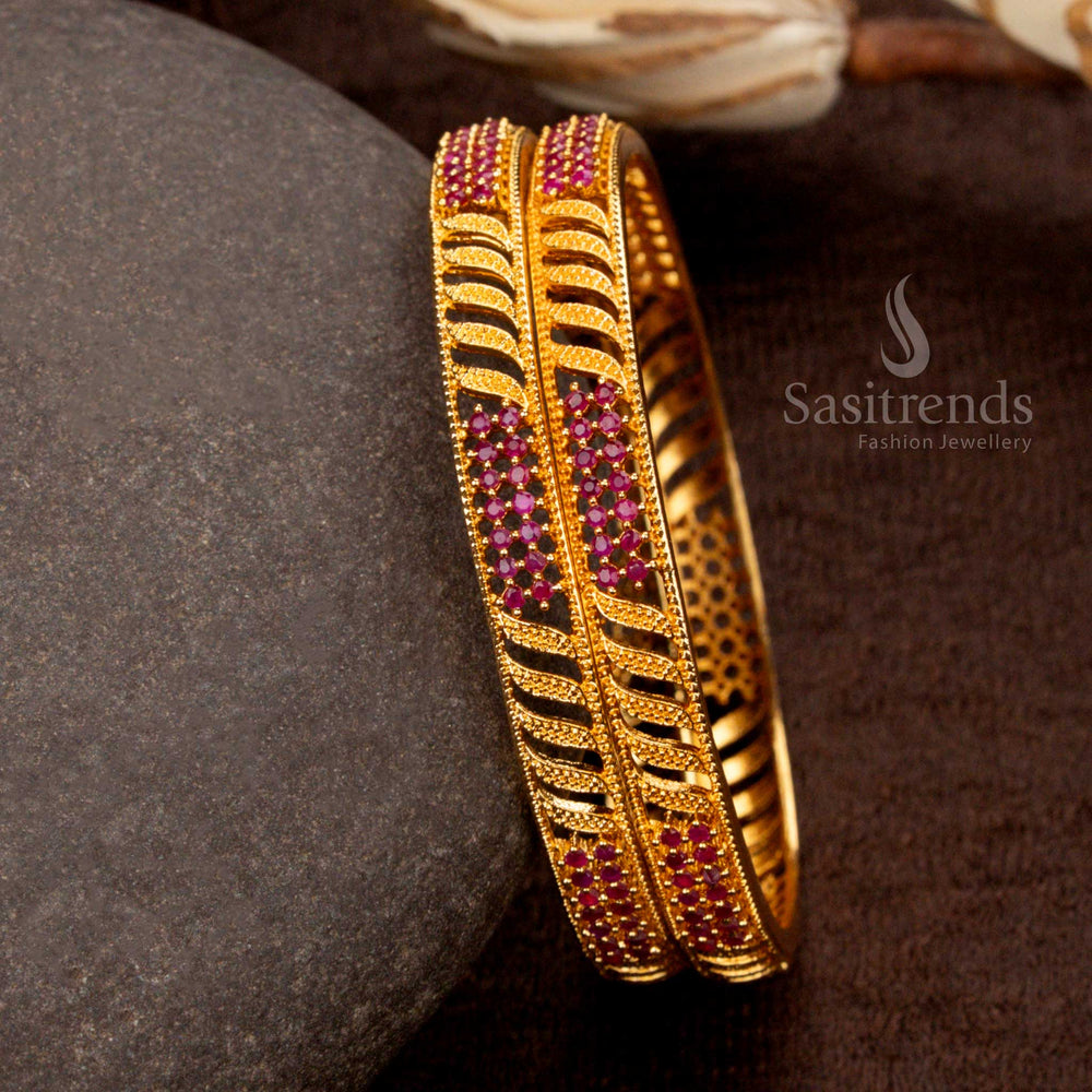 Exquisite micro gold-plated leaf designer bangles adorned with shimmering ruby-hued American diamond stones - Sasitrends