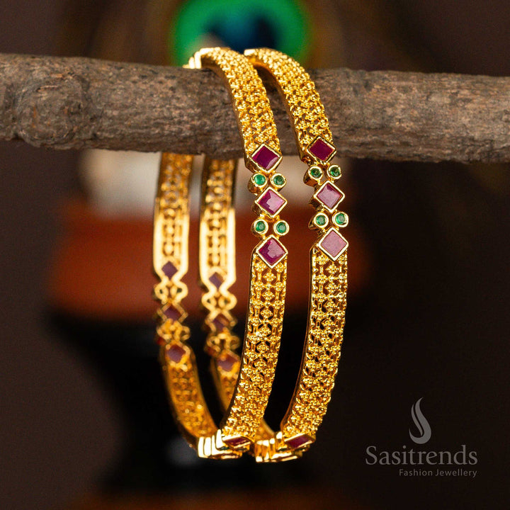 Opulent traditional micro gold-plated bangles featuring intricate triangle and round American diamond stones in an enchanting ruby-green  - Sasitrends