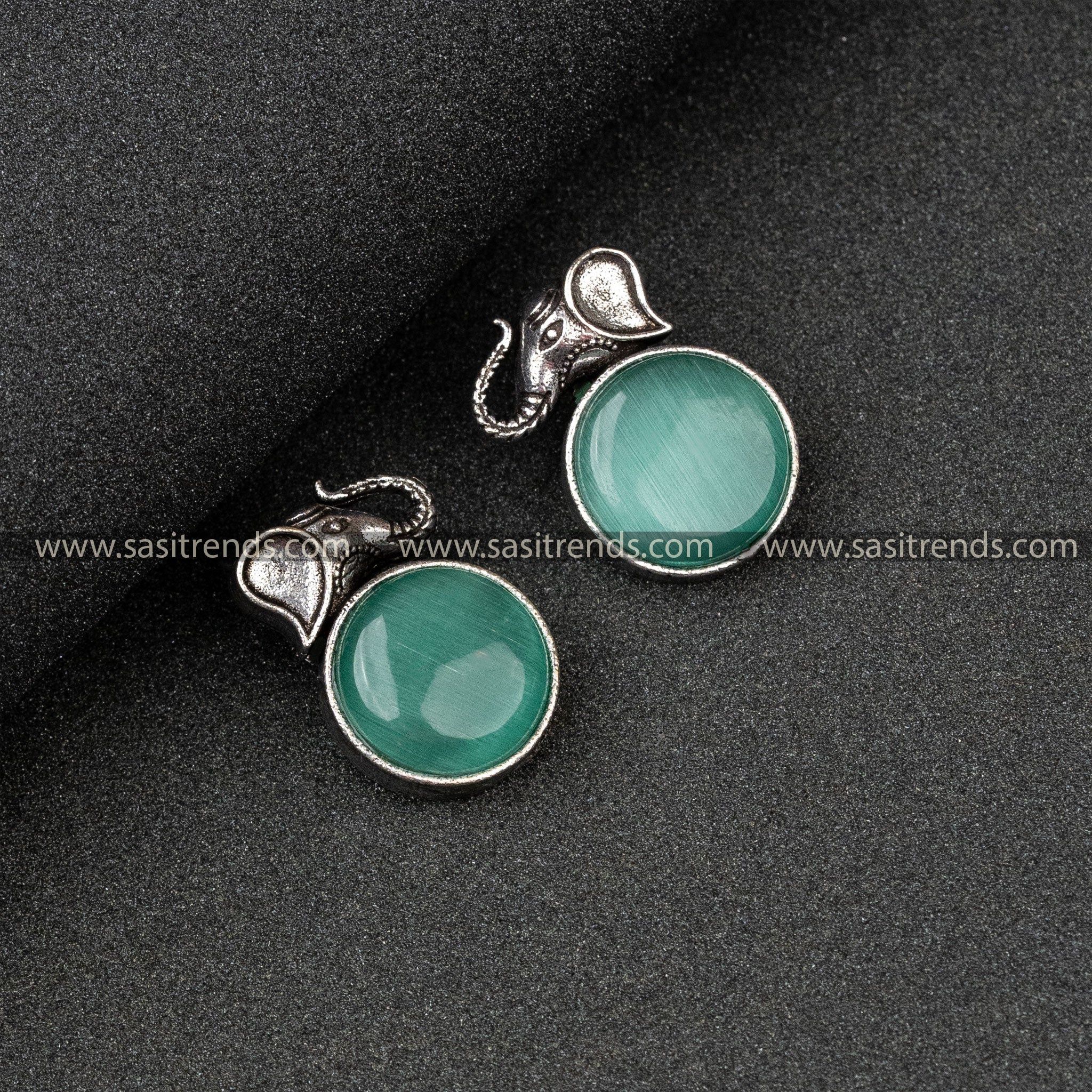 Party Wear Oxidised German Silver Elephant Head And Round Monalisa Stone Mint Earrings