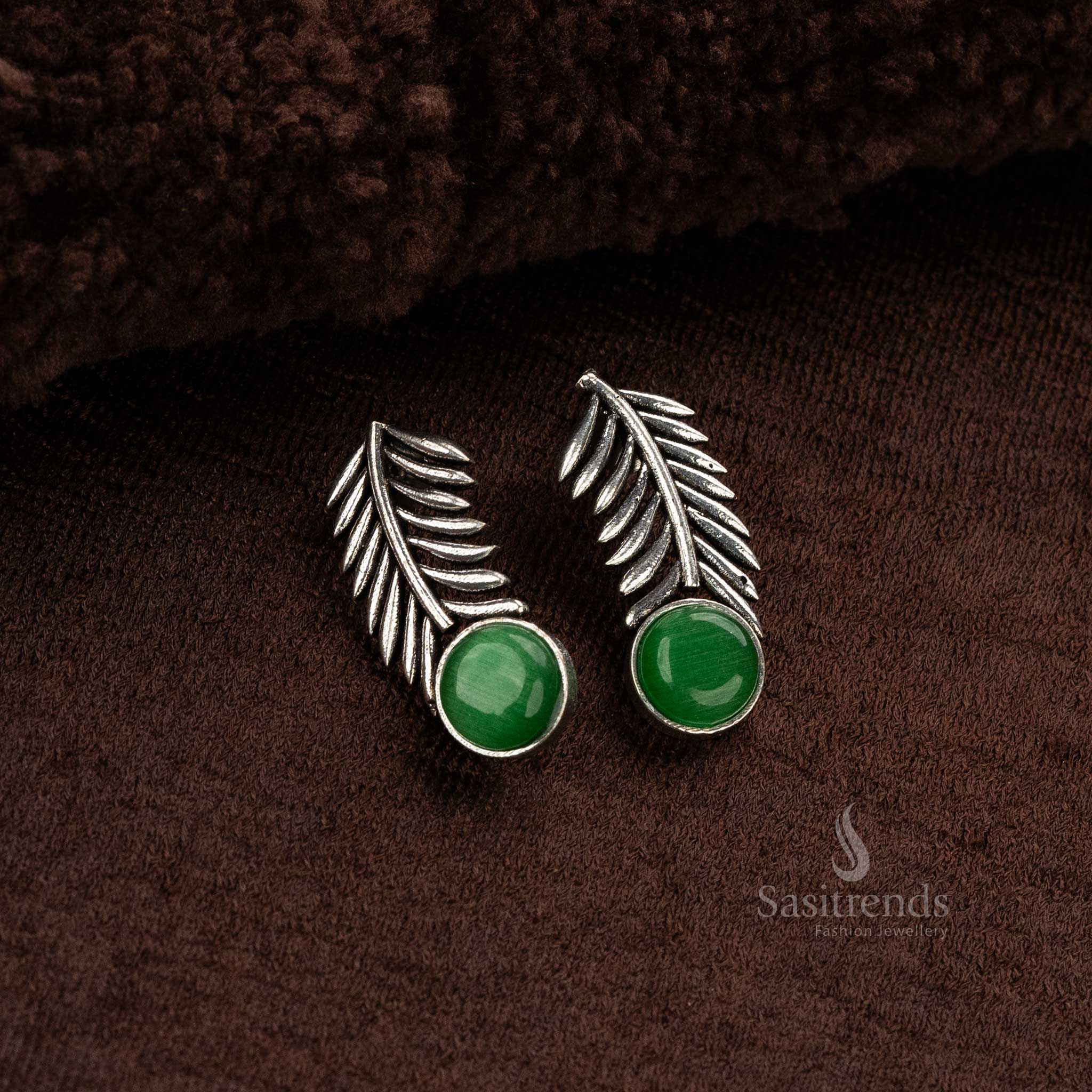 Casual wear Oxidised German silver earrings with glossy green Monalisa stone and elegant leaf design - Sasitrends