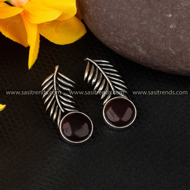 Deep burgundy Monalisa stone earrings with leaf detailing in oxidised German silver