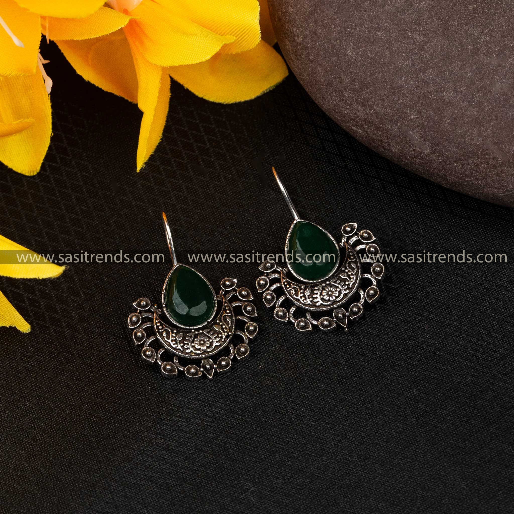 Boho fish hook earrings with emerald green stones in silver