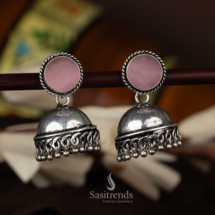 Feminine oxidised jhumka earrings with pale pink stone and intricate silver work - Sasitrends