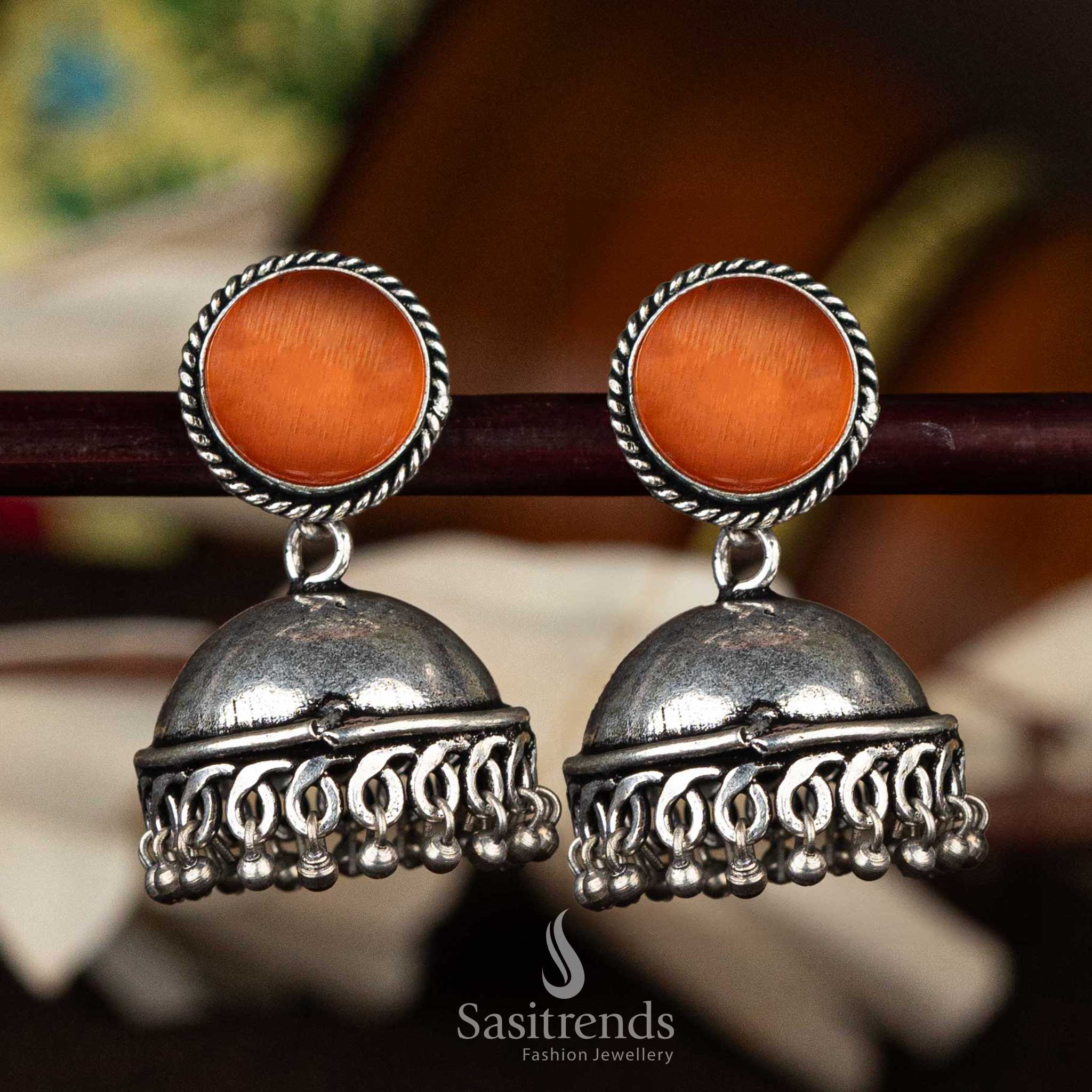 Deep maroon stone oxidised dome jhumka earrings with intricate detailing - Sasitrends