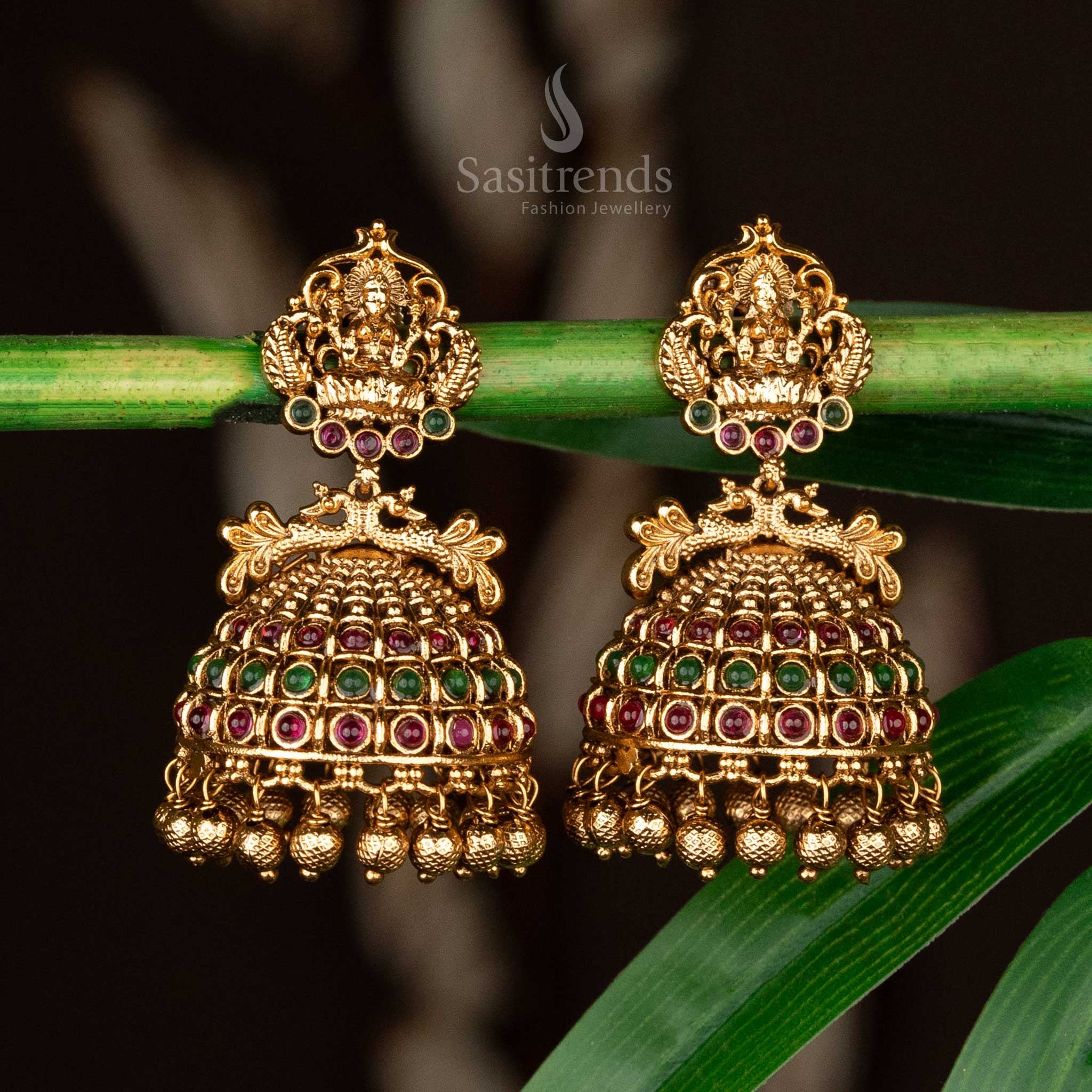 Lakshmi bridal jhumkas in matte gold-plated finish with ruby-green accents and beads - Sasitrends