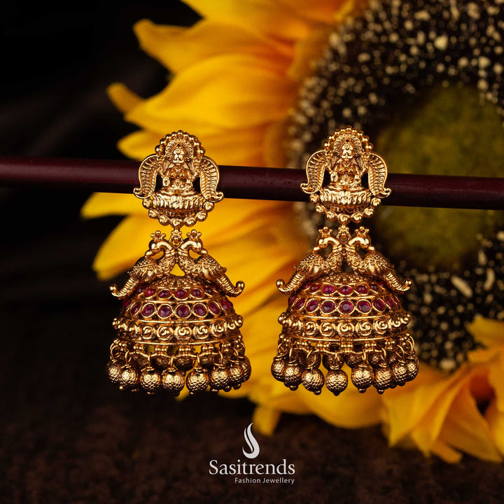 Temple bridal jhumka earrings with Lakshmi and peacock design in Ruby - Sasitrends





