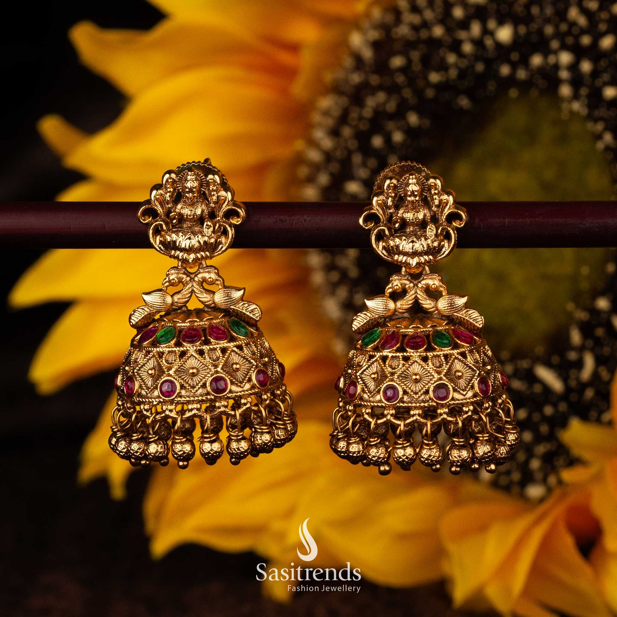 Temple jhumka earrings with Lakshmi, ruby, and green stones - Sasitrends





