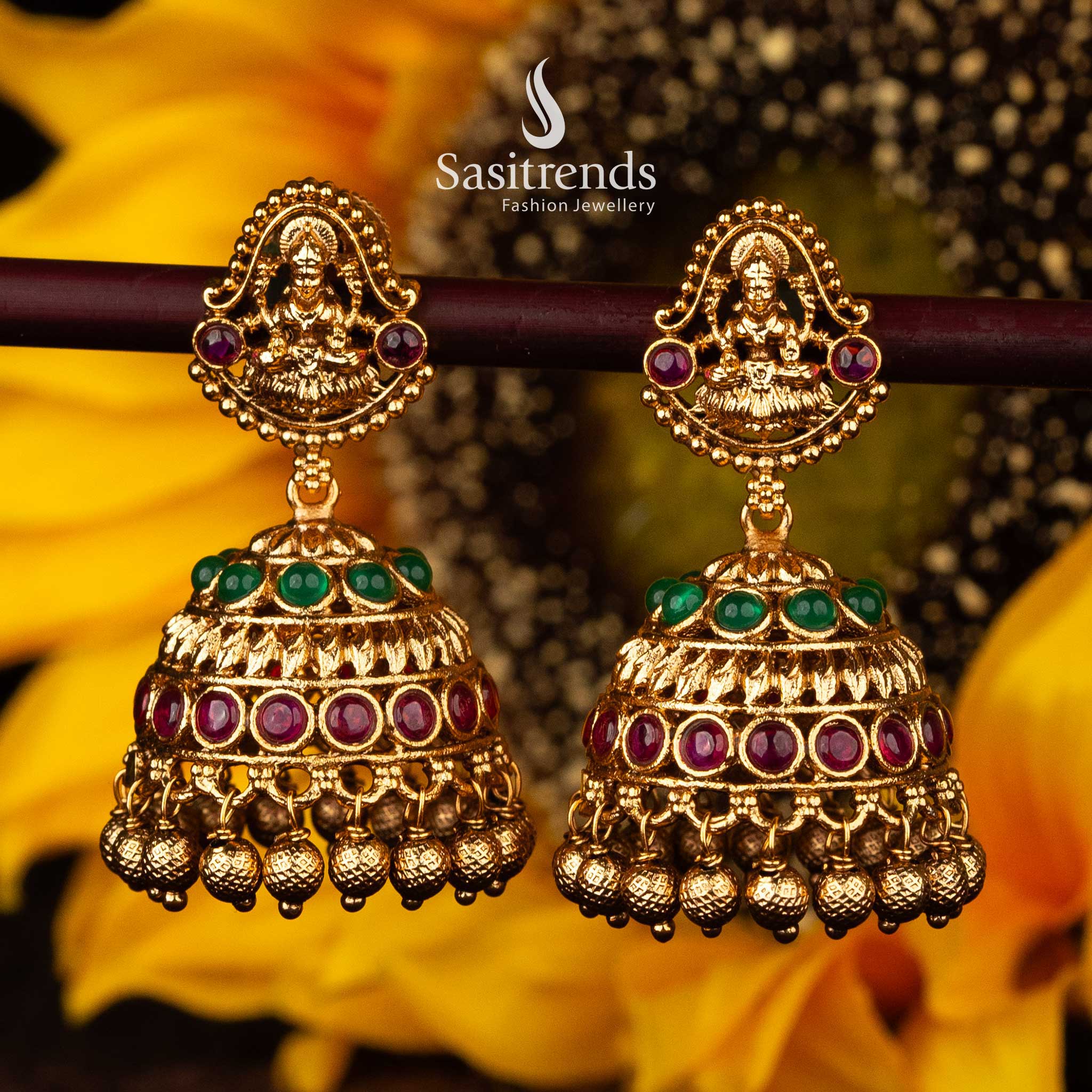 Ruby and green Lakshmi temple jhumka earrings with golden accents - Sasitrends