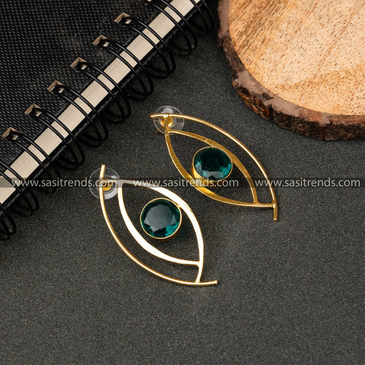 Elegant Gold Plated Topaz Blue Monalisa Stone Studded Push Back Eye Pattern Earrings