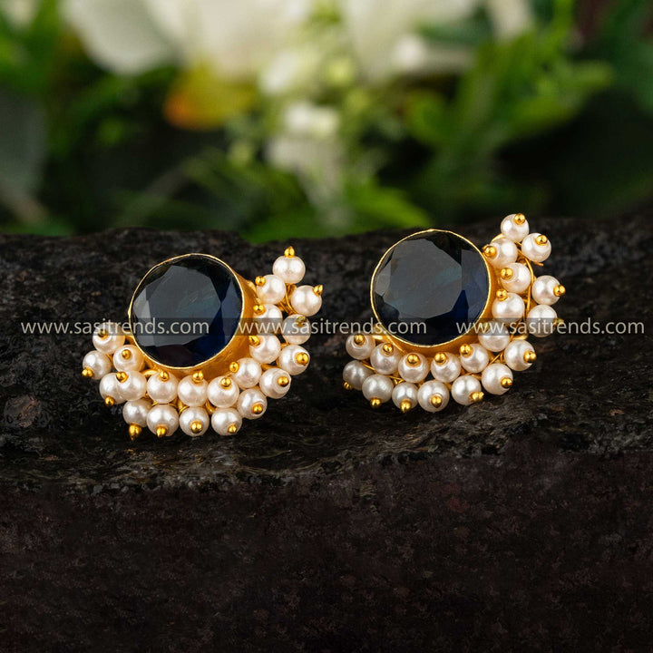 Gold-plated earrings featuring deep blue stone and pearls by sasitrends