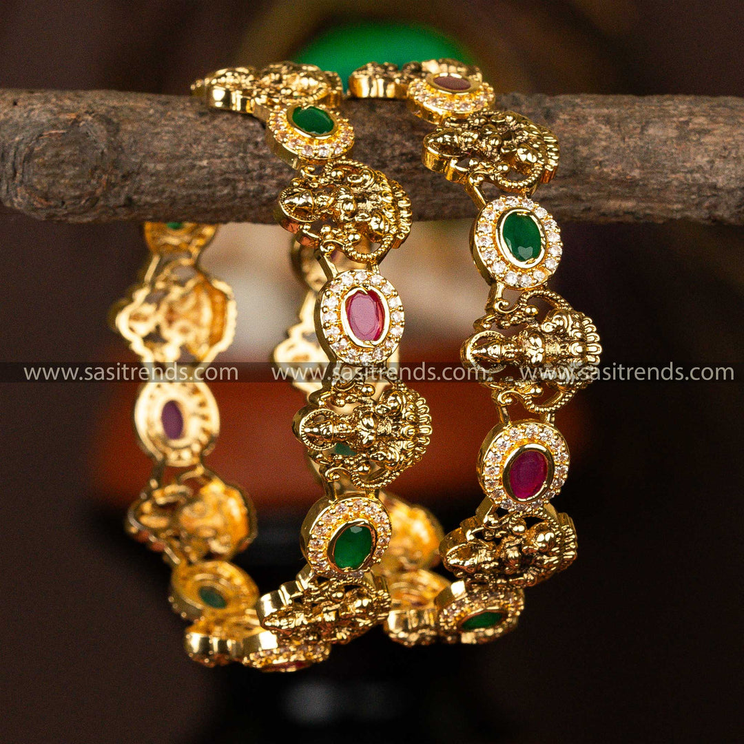 Temple Wear Matt Golf Plated Lakshmi Motif Ruby Green AD Stone Studded Bangles Sasitrends