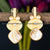 Elegant gold disc earrings with pearl embellishments and Mother of Pearl drop