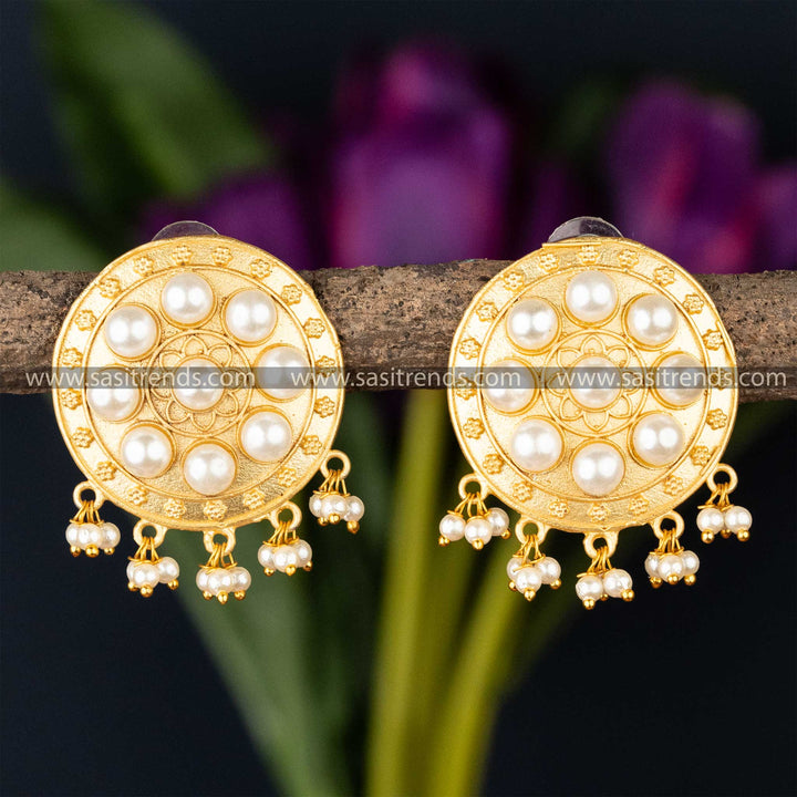 Floral golden disc earrings with pearl details and tassel charm, perfect for a touch of elegance