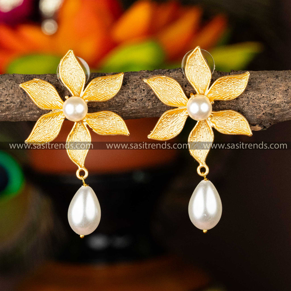 Gold-plated pearl earrings with a floral motif and pearl drop