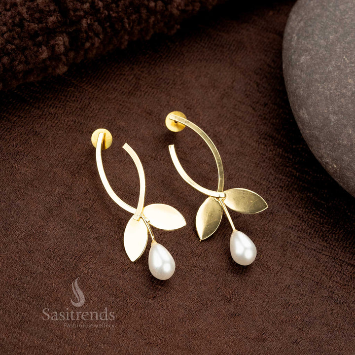 Stylish traditional wear gold-plated earrings with a curved design and pearls - Sasitrends