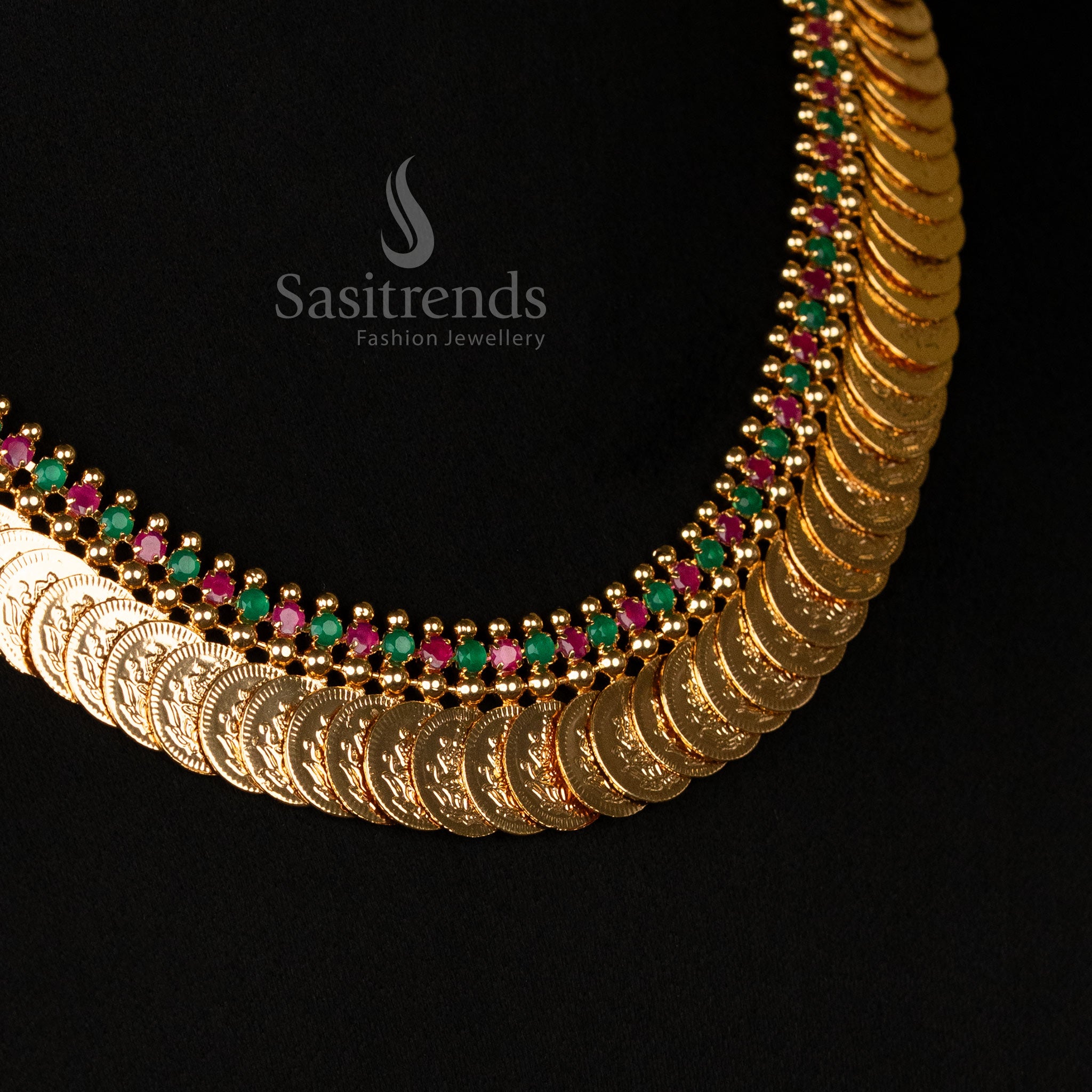 Exquisite micro gold-plated Lakshmi coin short necklace, adorned with vibrant ruby-green stones, a perfect temple jewellery piece for sarees and ethnic festive looks - Sasitrends