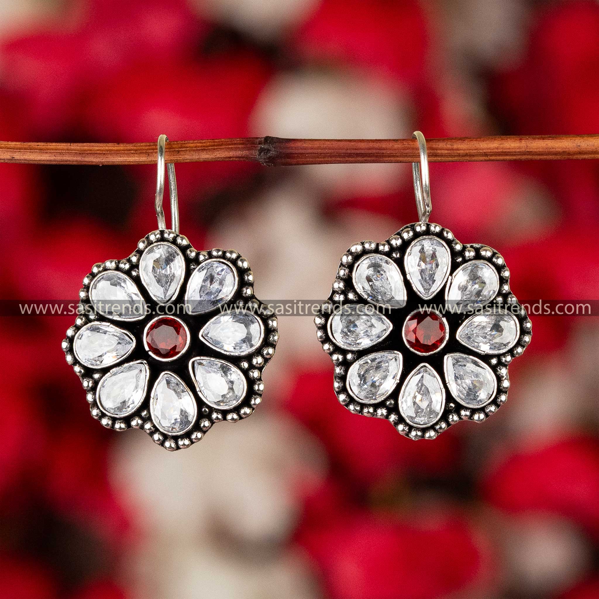 Sapphire White Ruby stone-studded oxidized silver floral earrings