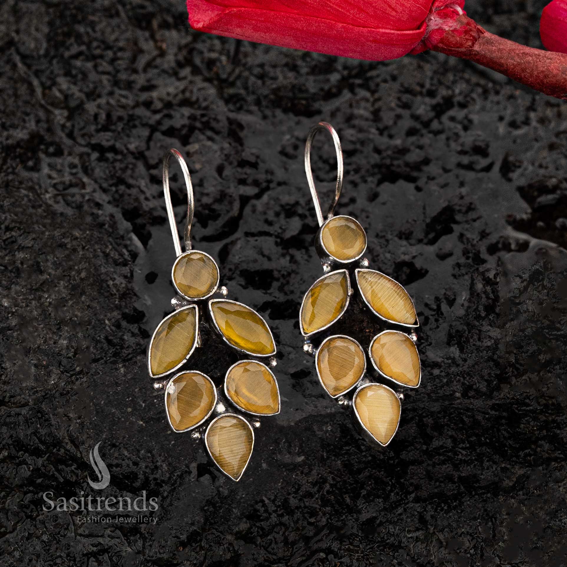 Golden-yellow stone oxidised earrings with a rustic silver finish, featuring a nature-inspired leaf design - Sasitrends