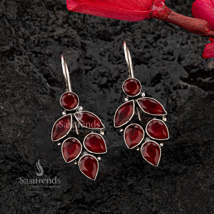 Bold red oxidised earrings with leaf pattern teardrop and marquise stones, adding vibrant elegance - Sasitrends