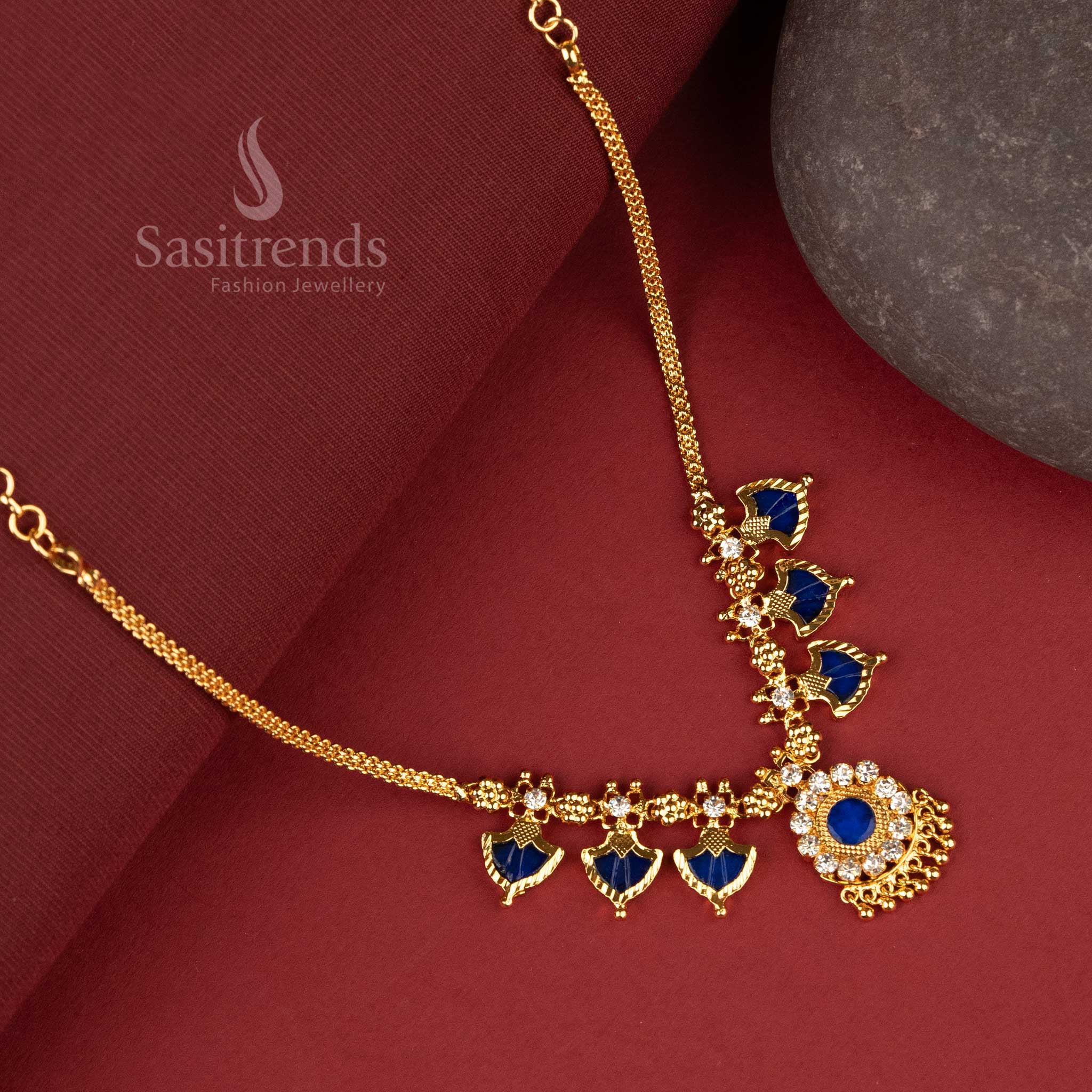 Elegant one gram micro gold-plated necklace designed with three blue palakka petals arranged in a clustered floral pattern, symbolizing traditional artistry - Sasitrends