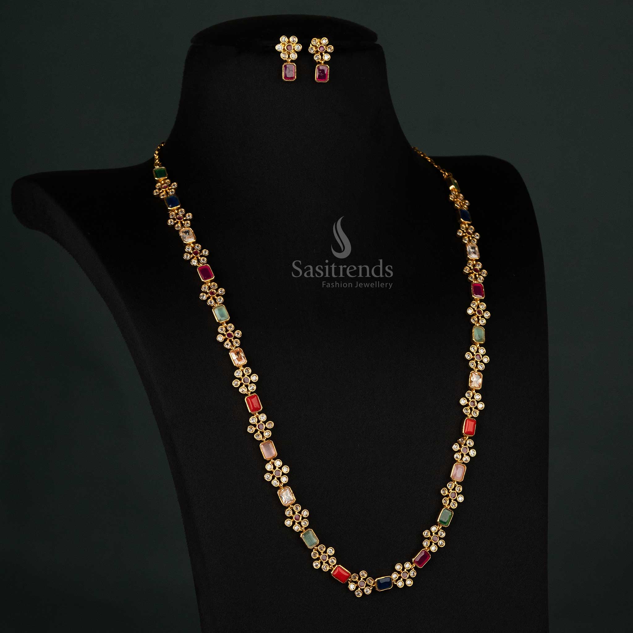 Golden matte finish long jewellery set with stunning multi-color stones and a beautiful blend of flower and rectangular patterns - Sastrends