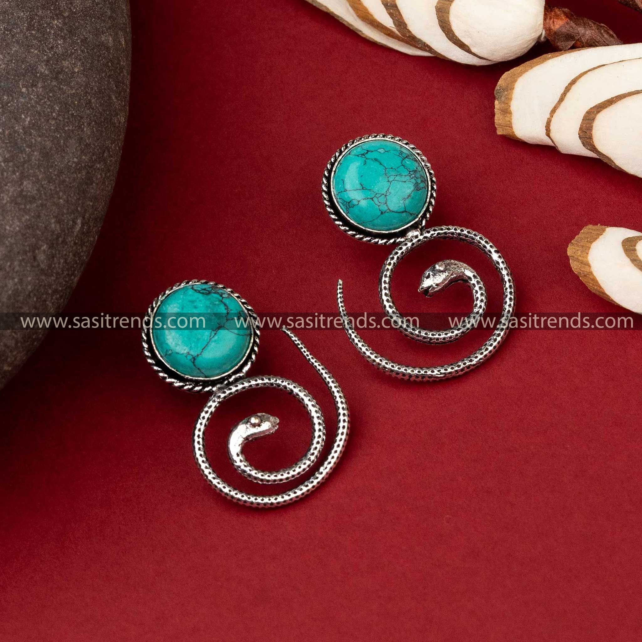 Coiled snake oxidized earrings with turquoise Monalisa stone