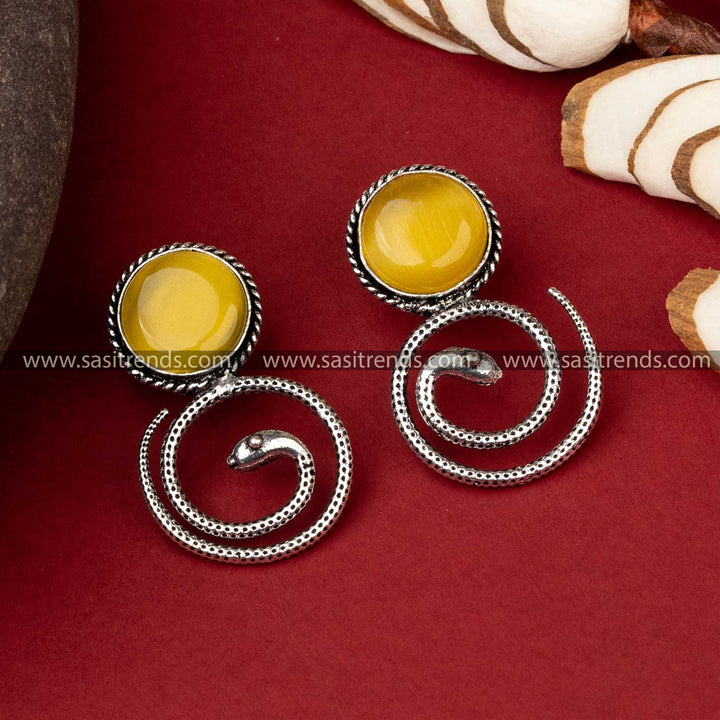 Coiled snake oxidized earrings with amber Monalisa stone