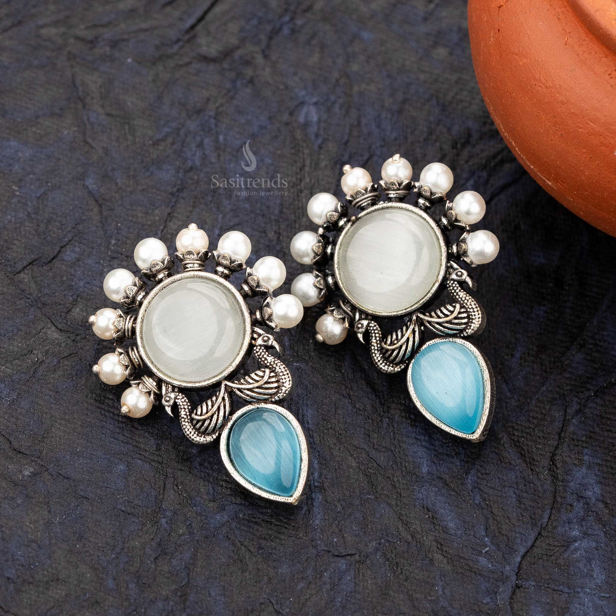 Soft blue casual Wear earrings with peacock plume and circular gemstone - sasitrends