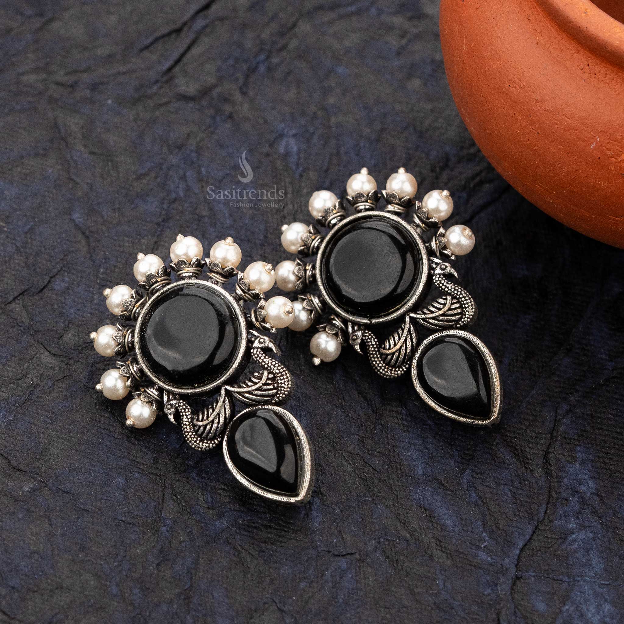 Black Trendy earrings with bold peacock feather and pearl detailing - sasitrends