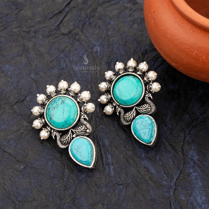 Turquoise elegant earrings with a circular gemstone and detailed peacock wings - sasitrends