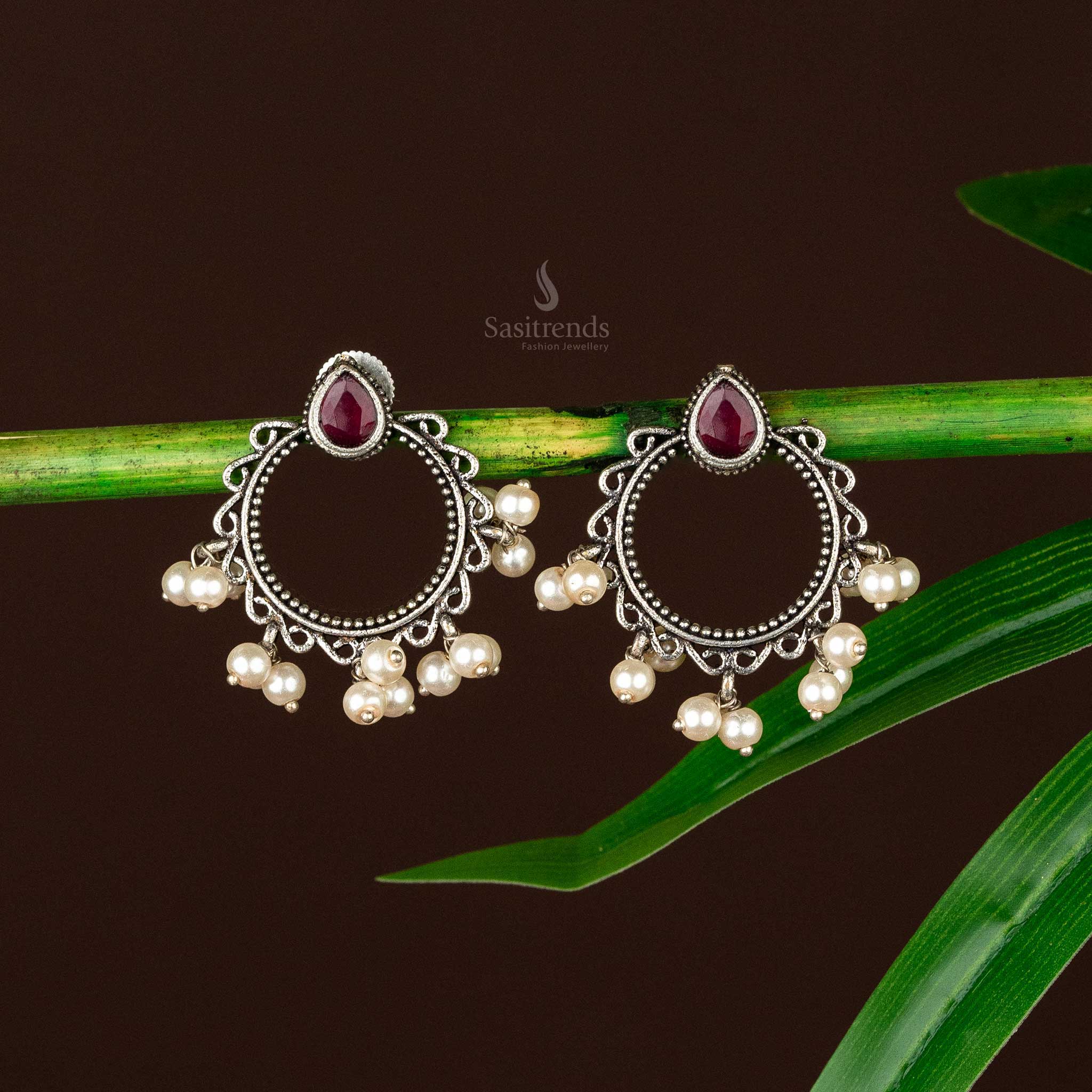 Intricate oxidised silver Office Wear earrings with ruby stone and pearl drops - sasitrends