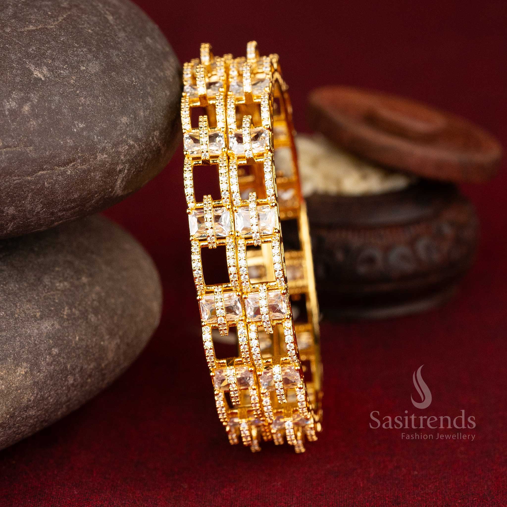 Radiant glow micro gold-plated American diamond bangles with a bold geometric design showcasing intricate square patterns in white and ruby - Sasitrends